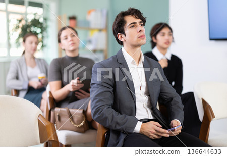 Young man on corporate training Young man on corporate training 136644633
