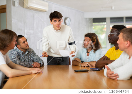 Group of men discussing something at the desk 136644764