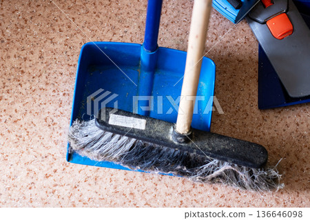 Sanitary tools placed on speckled surface with gentle illumination emphasizing routine chores 136646098