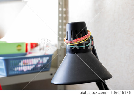 Modern lamp brightens workspace effectively. Vibrant lamp adds style and function to small desks 136646126