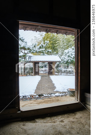 Snow scene at the mansion gate 136646975