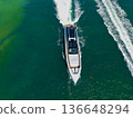 Yacht boat tour. Luxury boat yachting. Motorboat sailing at sea. Luxury charter yacht in sea. Motor yacht luxury vessel. Sea motor boat. Sea summer vacation. Aerial motorboat. Miami vibes 136648294