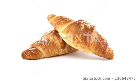 Two golden croissants topped with coarse sugar on a clean white background for bakery uses Two golden croissants topped with coarse sugar on a clean white background for bakery uses 136648475