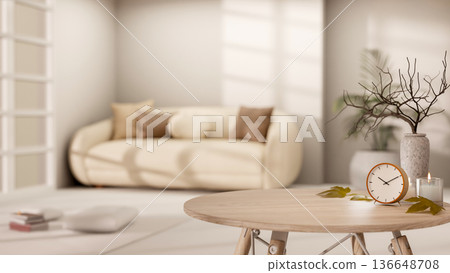 Clock and candle aside vase on round wooden table across sofa in a living room with bright sunlight. Clock and candle aside vase on round wooden table across sofa in a living room with bright sunlight. 136648708