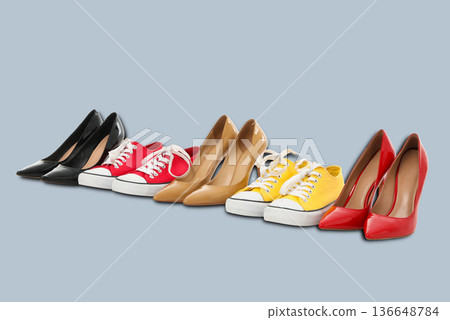 Different styles of womens shoes are arranged in a row Different styles of womens shoes are arranged in a row 136648784