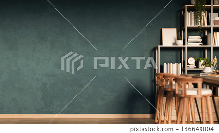 Wooden stool chairs and table across bookshelf and dark grey green wall in a living room or library. Wooden stool chairs and table across bookshelf and dark grey green wall in a living room or library. 136649004