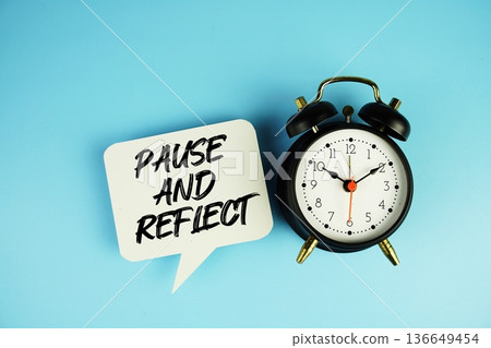 Pause And Reflect text on speech bubble with alarm clock on blue background 136649454