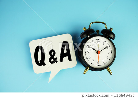 Q & A text on speech bubble with alarm clock on blue background 136649455