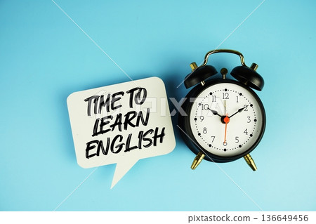 Time To Learn English text on speech bubble with alarm clock on blue background Time To Learn English text on speech bubble with alarm clock on blue background 136649456