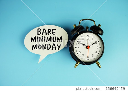 Bare Minimum Monday text on speech bubble with alarm clock on blue background Bare Minimum Monday text on speech bubble with alarm clock on blue background 136649459