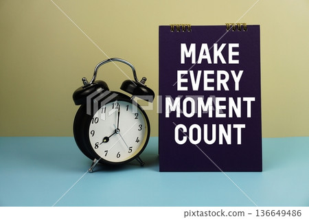 Make Every Moment Count text with alarm clock on yellow and blue background Make Every Moment Count text with alarm clock on yellow and blue background 136649486