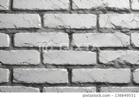 Aged white brick wall with cracks and rough surface. Ideal for vintage, industrial, or modern backgrounds, interior design, or creative projects. 136649551