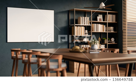 Bread on plate and potted plant on wooden table aside white frame board on dark wall and bookshelf. 136649788