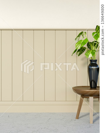 Green plant in black vase on wooden table over stone floor corridor aside beige slats on white wall. Green plant in black vase on wooden table over stone floor corridor aside beige slats on white wall. 136649800