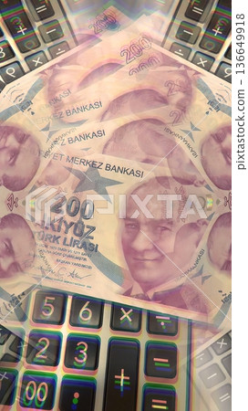 Turkish Lira and Calculator Finance Concept. 200 TRY banknotes on calculator representing Turkish economy, budgeting, and financial planning. 200 Turkish Lira banknotes placed on a black calculator. Turkish Lira and Calculator Finance Concept. 200 TRY banknotes on calculator representing Turkish economy, budgeting, and financial planning. 200 Turkish Lira banknotes placed on a black calculator. 136649918