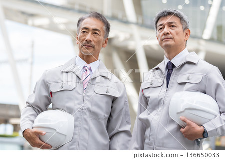 Workers working at a construction site Workers working at a construction site 136650033