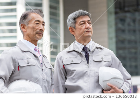 Workers working in the field Workers working in the field 136650038