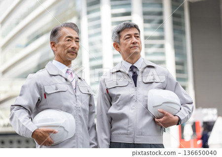 A middle-aged male worker working at the site A middle-aged male worker working at the site 136650040