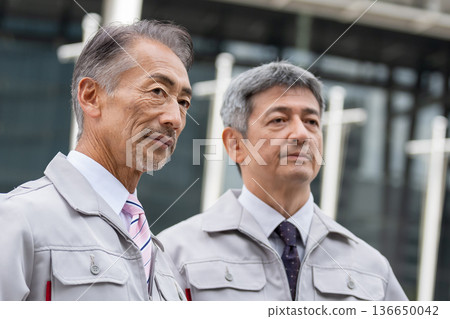A man in work clothes standing at the site A man in work clothes standing at the site 136650042