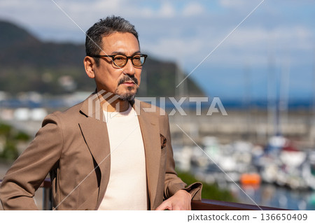 A senior man who enjoys traveling A senior man who enjoys traveling 136650409