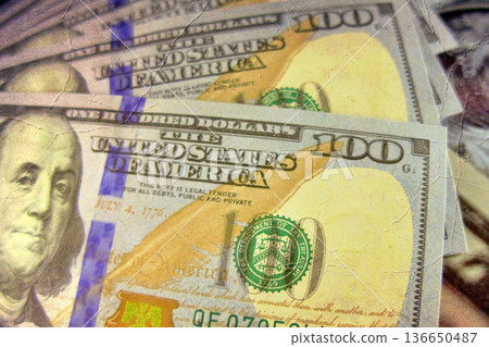 Vintage Style Stack of US Hundred Dollar Bills. A textured, old-photo effect overlaying a pile of $100 American banknotes, highlighting financial concepts and wealth. 136650487