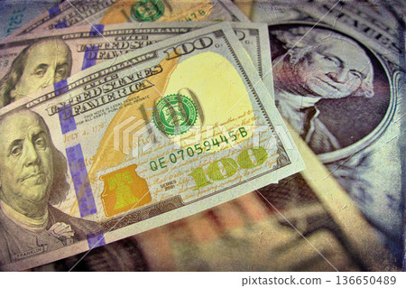 Vintage Style Stack of US Hundred Dollar Bills. A textured, old-photo effect overlaying a pile of $100 American banknotes, highlighting financial concepts and wealth. Vintage Style Stack of US Hundred Dollar Bills. A textured, old-photo effect overlaying a pile of $100 American banknotes, highlighting financial concepts and wealth. 136650489
