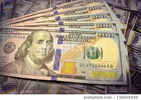 Vintage Style Stack of US Hundred Dollar Bills. A textured, old-photo effect overlaying a pile of $100 American banknotes, highlighting financial concepts and wealth. Vintage Style Stack of US Hundred Dollar Bills. A textured, old-photo effect overlaying a pile of $100 American banknotes, highlighting financial concepts and wealth. 136650499