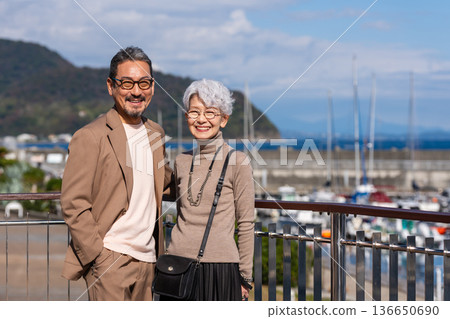 Senior couple traveling. Photo courtesy of Ito Marine Town Roadside Station. Senior couple traveling. Photo courtesy of Ito Marine Town Roadside Station. 136650690