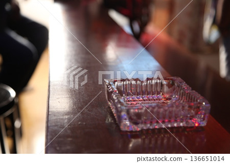 Glass Ash tray on a table 136651014