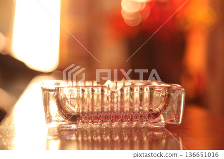 Glass Ash tray on a table 136651016
