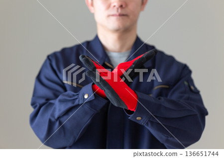 Middle-aged male businessman in work clothes making a cross sign Middle-aged male businessman in work clothes making a cross sign 136651744