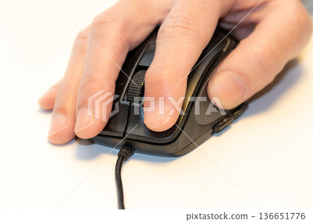 Hand operating a mouse Hand operating a mouse 136651776