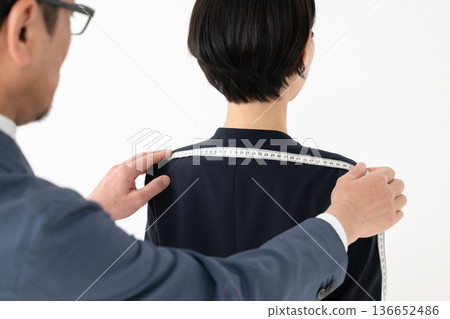 Man measuring suit size Man measuring suit size 136652486