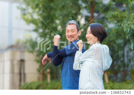 Men and women exercising 136652743