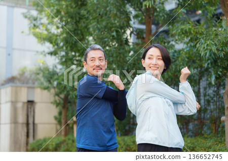 Men and women exercising 136652745