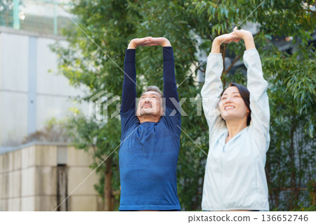 Men and women exercising 136652746