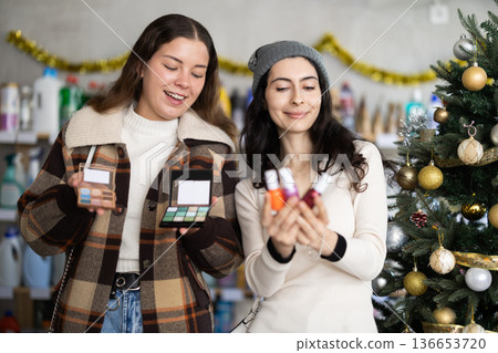 Women choose a set of polishes and cosmetics 136653720