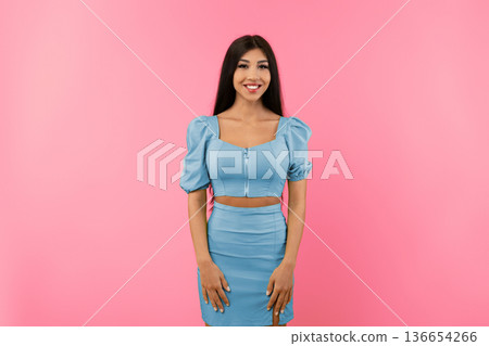 Casual Person Concept. Portrait of smiling young female wearing green dress outfit posing standing isolated on yellow studio background wall. Happy millennial lady looking at camera 136654266