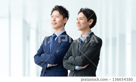 Teamwork image of two business men Teamwork image of two business men 136654380