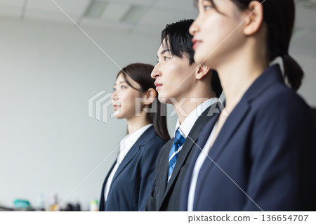 Young men and women in suit Young men and women in suit 136654707