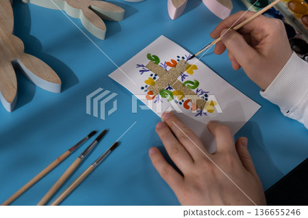 Drawing Easter cross Storytelling of creating craft Easter greeting card holiday present. Tactile hand-on activity. Master class progress of creative me-made gifts. Seasonal domestic life micro moment 136655246