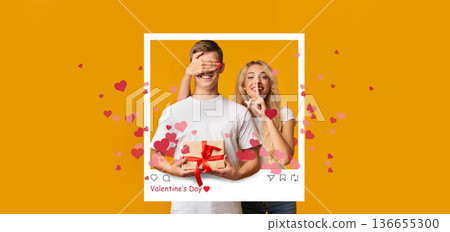 Two people are enjoying Valentine's Day. One person covers the other's eyes while holding a gift. Red hearts surround them, creating a festive mood. 136655300