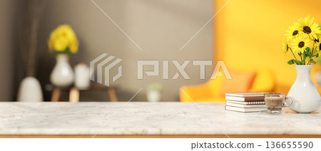Coffee in glass cup and books aside sunflower vase on marble counter table in grey yellow wall room. 136655590