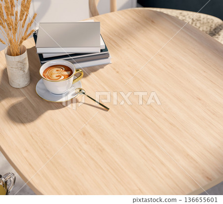 Top view of latte art coffee cup with spoon aside books and flower vase on wooden table in sunlight. Top view of latte art coffee cup with spoon aside books and flower vase on wooden table in sunlight. 136655601