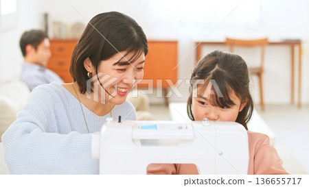 Family conversation sewing machine image Family conversation sewing machine image 136655717