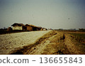 A scene of life in rural Nepal, with thatched houses, farm roads, and fields (photographed in 1989, editorial) 136655843