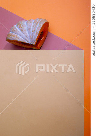 Geometric still life with ripe pumpkin  a colored background 136656430