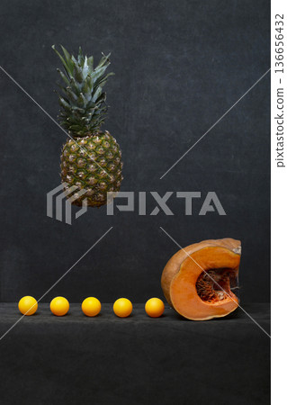 Still life with pumpkin, pineapple, and balloons Still life with pumpkin, pineapple, and balloons 136656432