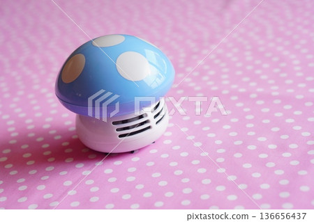 Mushroom-shaped table cleaner on a pink background Mushroom-shaped table cleaner on a pink background 136656437