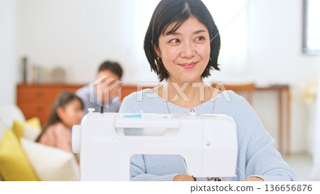 Family conversation sewing machine image Family conversation sewing machine image 136656876